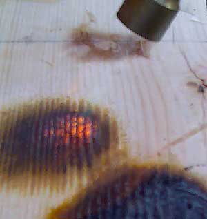 Attempting to set light to fire varnish treated wood